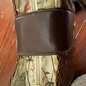 Elegant Brown wicker purse with leather accents. Classic yet unique